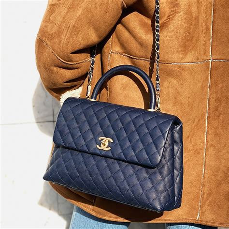 flap bag with top handle chanel 2019|Chanel handbag with top handle.